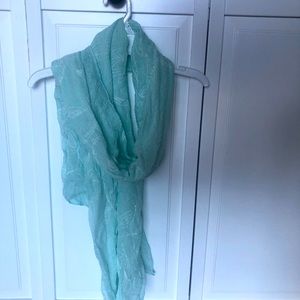 Mint green scarf with embroidery detail